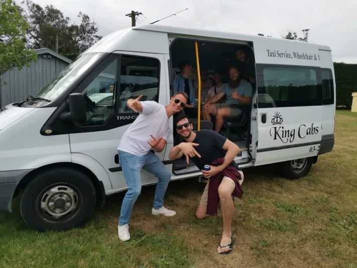Taxi Christchurch – King Cabs 4 King Cabs group maxi van with passengers stepping out